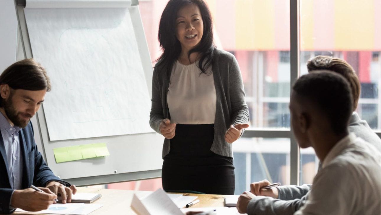 woman speaking during an office meeting