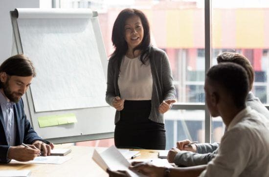 woman speaking during an office meeting