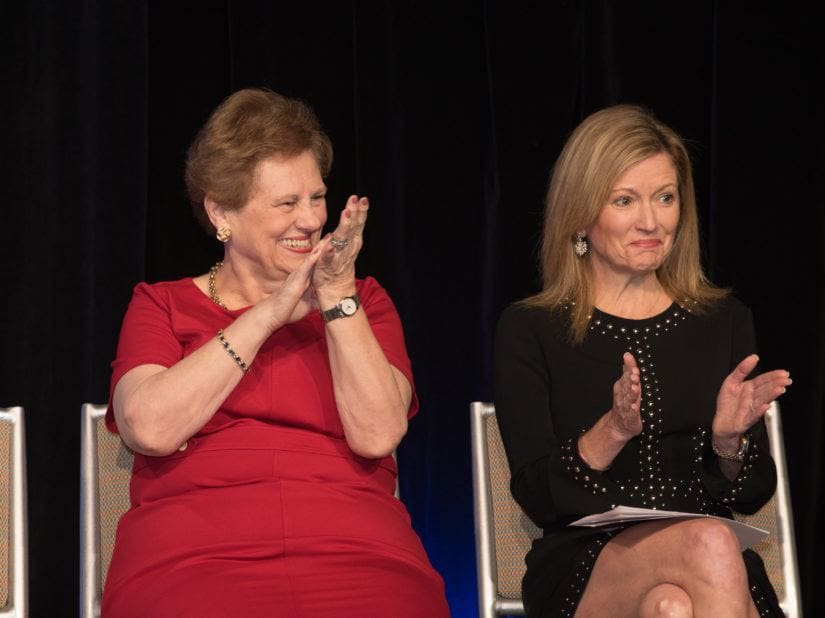 Two women clapping