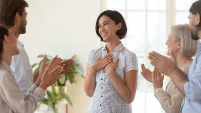 Woman Receiving Praise at Work