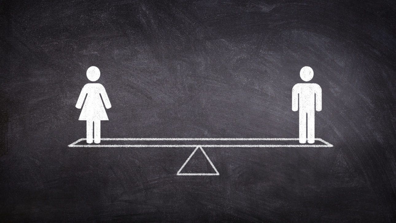 male and female stick figures on a scale