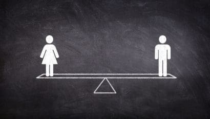 male and female stick figures on a scale