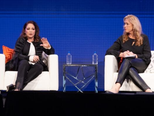 gloria estefan and susan mackenty brady on stage slc44