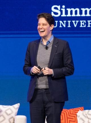 dorie clark on stage at the simmons leadership conference