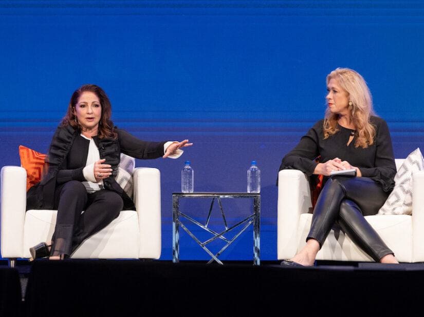 gloria estefan and susan mackenty brady on stage at the simmons leadership conference