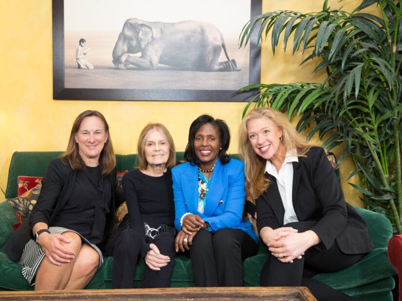 The authors of Arrive and Thrive: Janet Fouty, Executive Chair of the Board of Deloitte US, Susan MacKenty Brady the CEO of Simmons University Institute for Inclusive Leadership and Lynn Perry Wooten the President of Simmons University with Gloria Steinem the leader of second-wave feminism