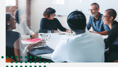 Diverse group of individuals sitting around a conference table
